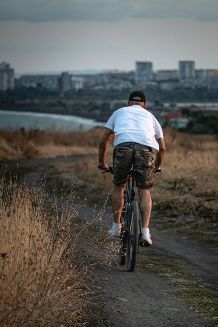 Photo by Dimitar Kazakov man driving the bicycle
