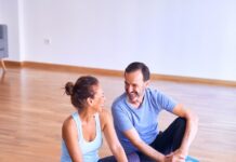 필라테스로 시작하는 아침 루틴, 하루가 달라진다 man in white tank top and gray pants sitting on blue yoga mat