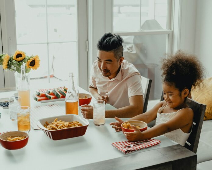 Photo by Tyson boy and girl eating on table