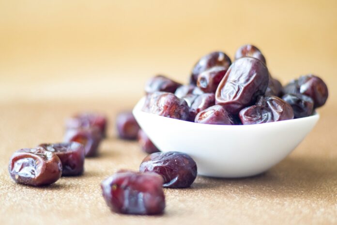 Photo by VD Photography brown round fruit on white ceramic bowl