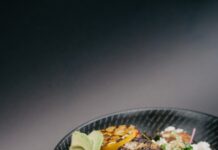 “지속가능한 식단, 일상 속 작은 변화로 만들기” grilled meat with green vegetable on black ceramic plate